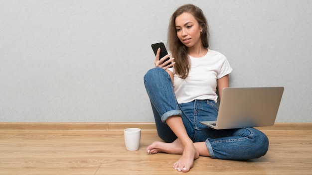 Full shot woman on floor working