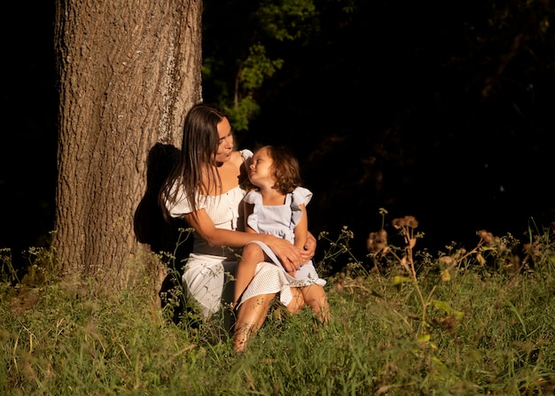 Free photo full shot woman and girl outdoors