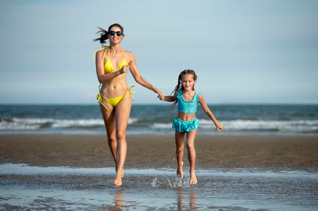 Full shot woman and girl running