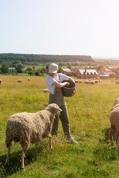 Free photo full shot woman holding bucket with food