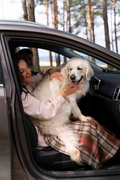 Full shot woman holding dog