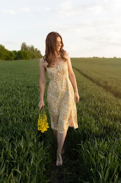 Full shot woman holding flowers