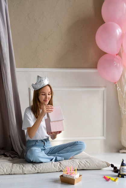 Full shot woman holding gift