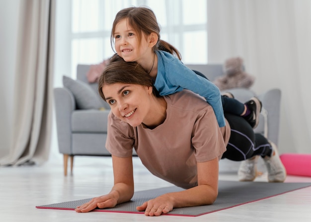 Full shot woman holding kid