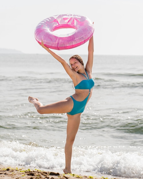 Free photo full shot woman holding pink lifeline