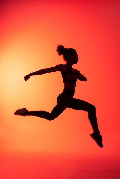 Full shot woman jumping