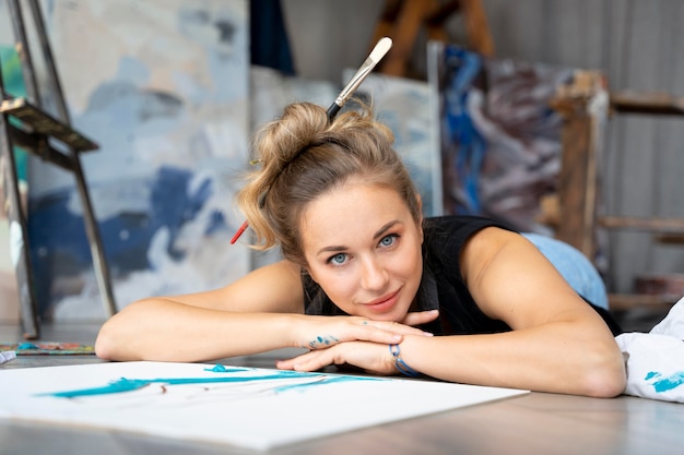 full shot woman laying on floor
