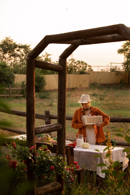 Full shot woman living at farmhouse