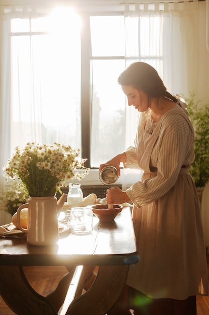 Free photo full shot woman living at farmhouse