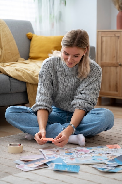 Free photo full shot woman making vision board