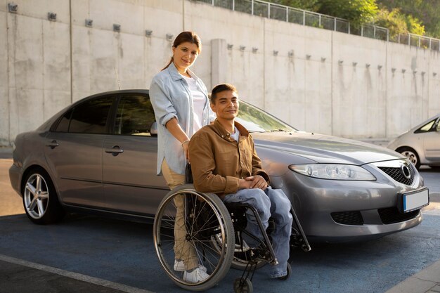 Full shot woman and man in wheelchair
