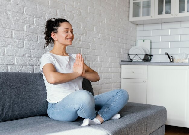 Full shot woman meditating