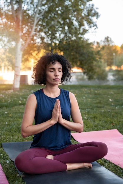 Full shot woman meditating