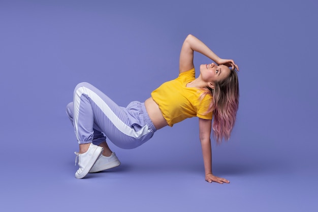 full shot woman moving her body