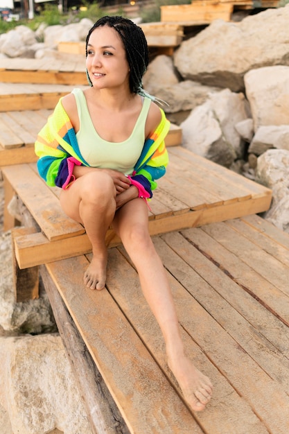 Full shot woman posing at beach