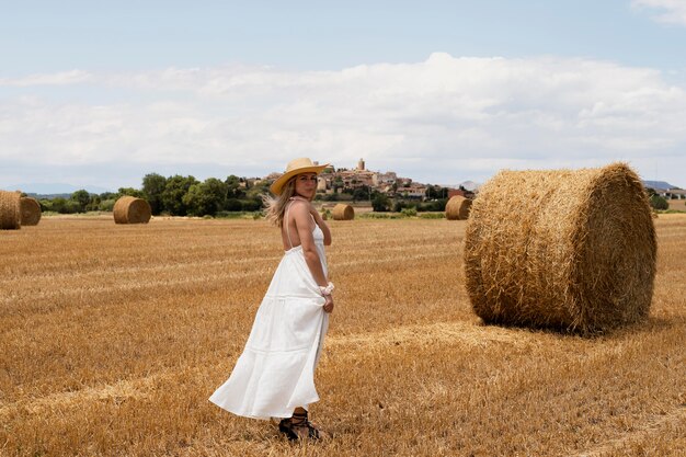 Full shot woman posing at countryside