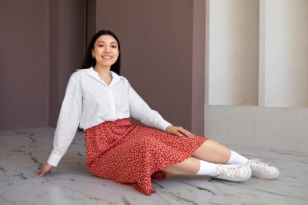 Full shot woman posing on floor