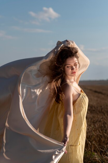 Full shot woman posing in nature