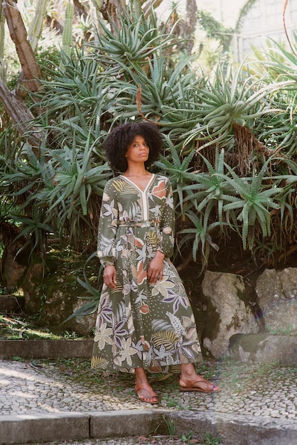 Full shot woman posing in romantic garden