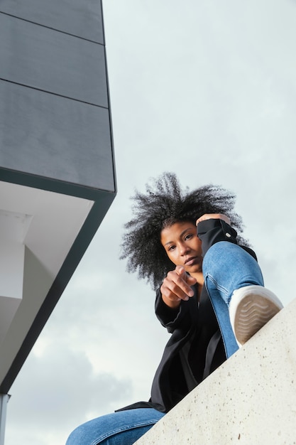 Full shot woman posing urban portrait