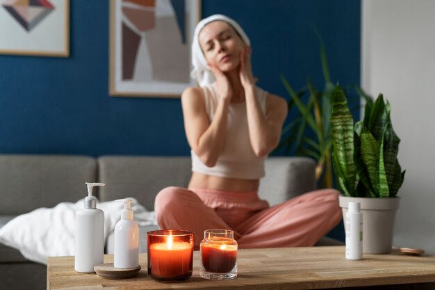 Full shot woman practicing facial yoga