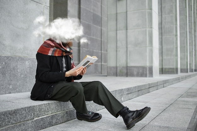 Full shot woman reading outdoors