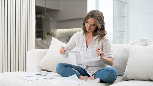 Full shot woman reading papers