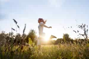 Free photo full shot woman running outdoors