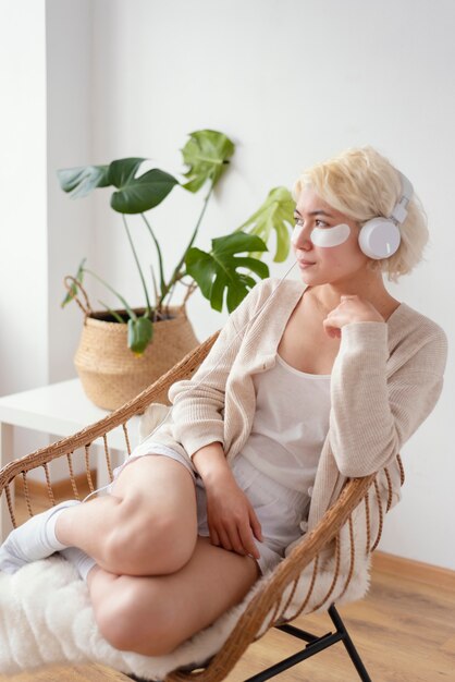 Full shot woman sitting on chair