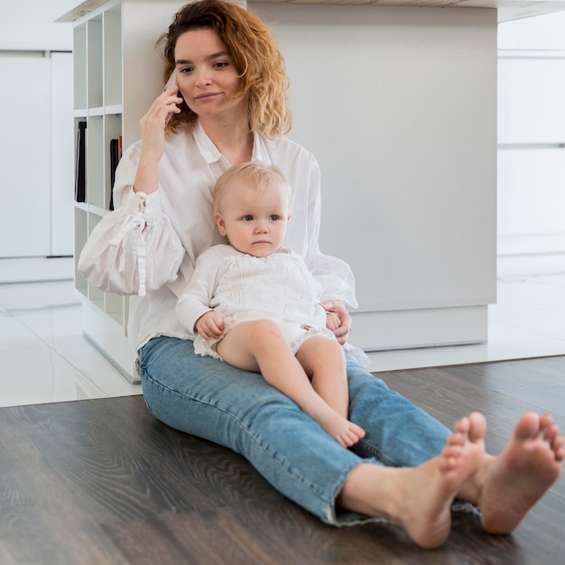 Full shot woman sitting on floor