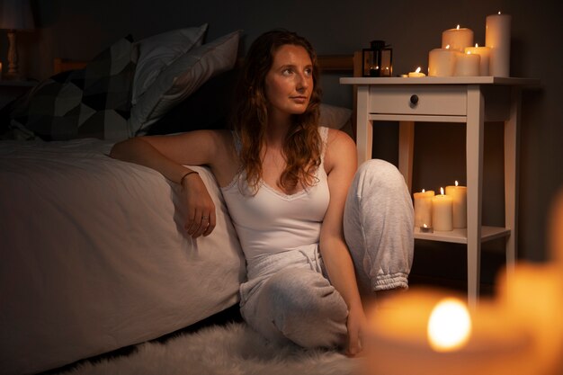 full shot woman sitting on floor