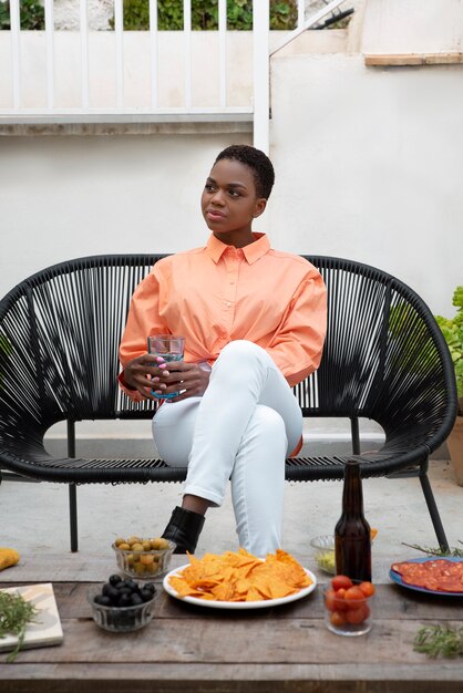 Full shot woman sitting at table