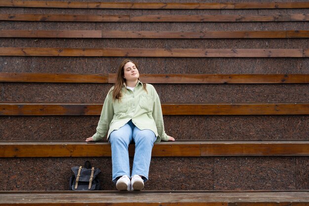 Full shot woman sitting