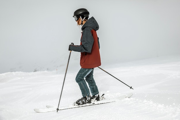 Full shot woman skiing