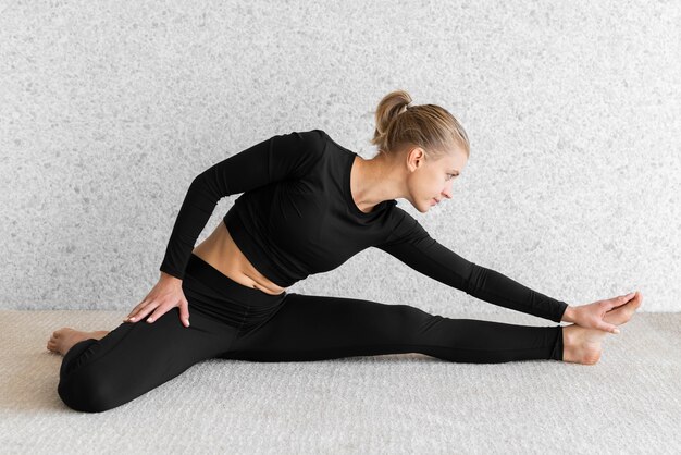 Full shot woman stretching