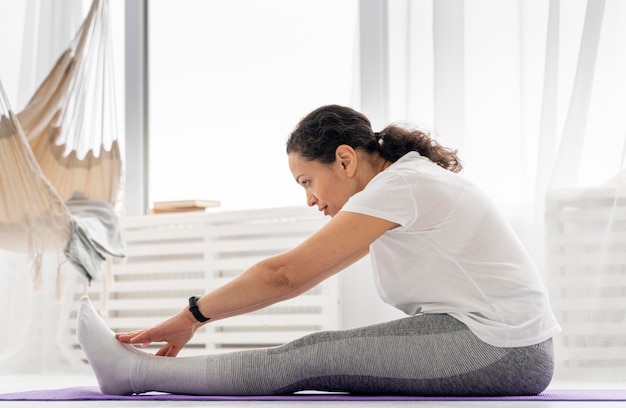 Full shot woman stretching