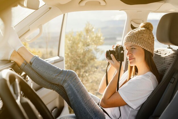 Full shot woman taking photos