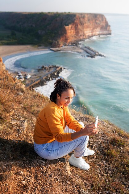 Full shot woman taking photos