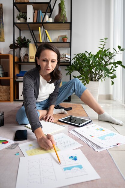 full shot woman teleworking