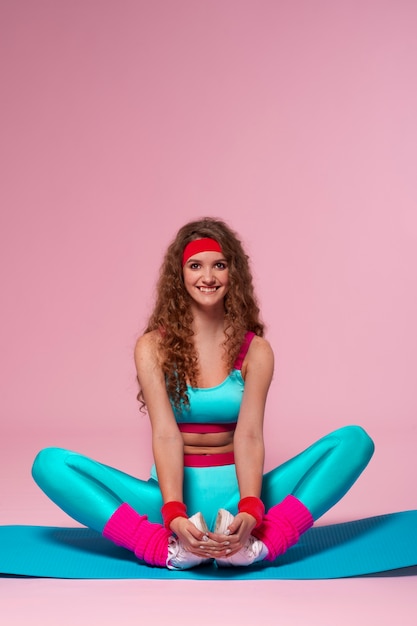 Free photo full shot woman training with  80's outfit