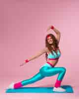 Free photo full shot woman training with  80's outfit