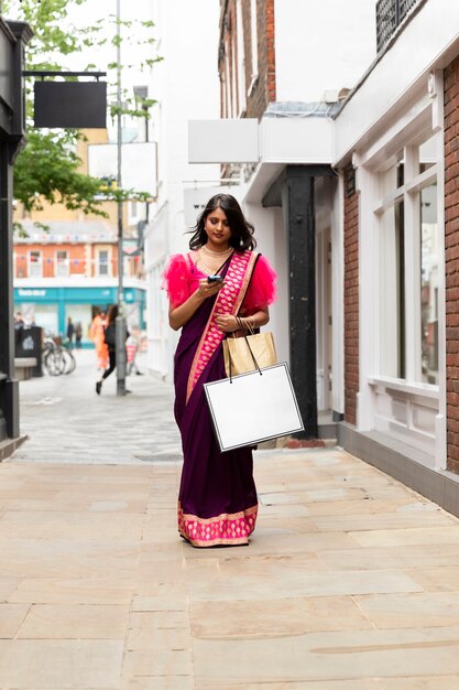 Full shot woman walking with shopping bags