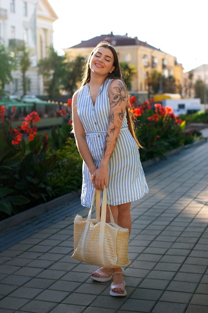 Free photo full shot woman wearing beautiful sundress