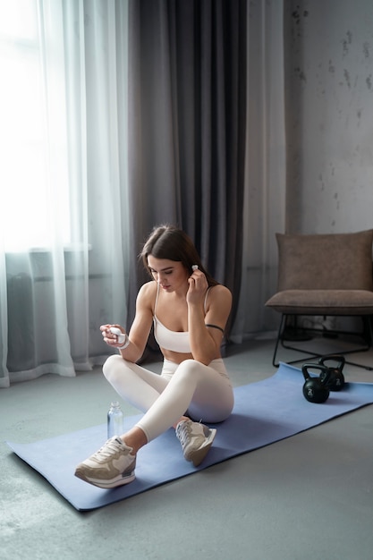 Full shot woman wearing earphones