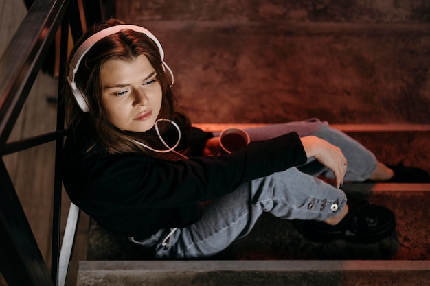 Full shot woman wearing headphones