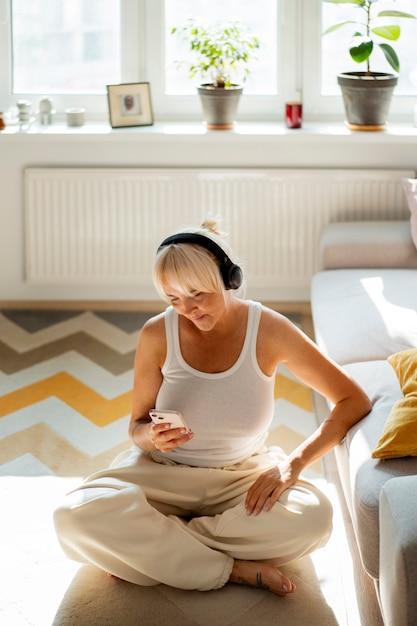 Full shot woman wearing headphones