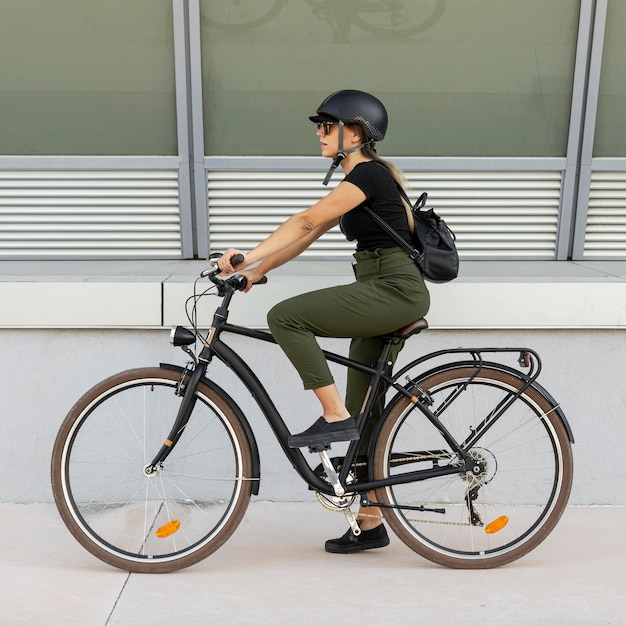 Full shot woman wearing helmet