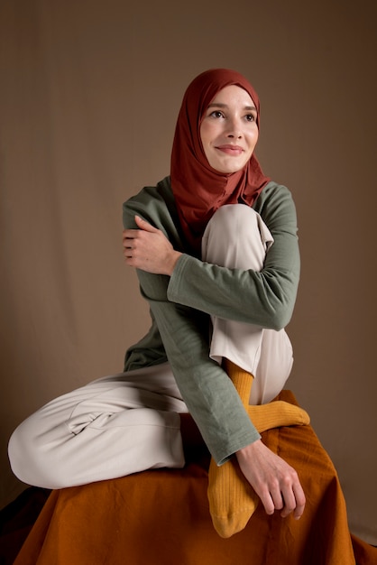 Full shot woman wearing hijab