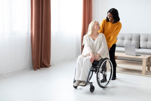 Full shot woman in wheelchair