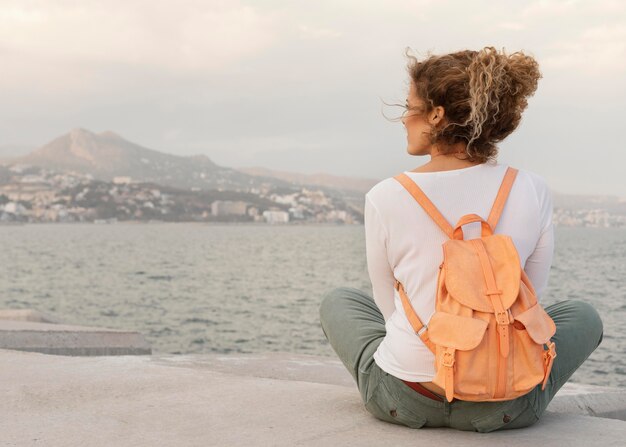 Full shot woman with backpack